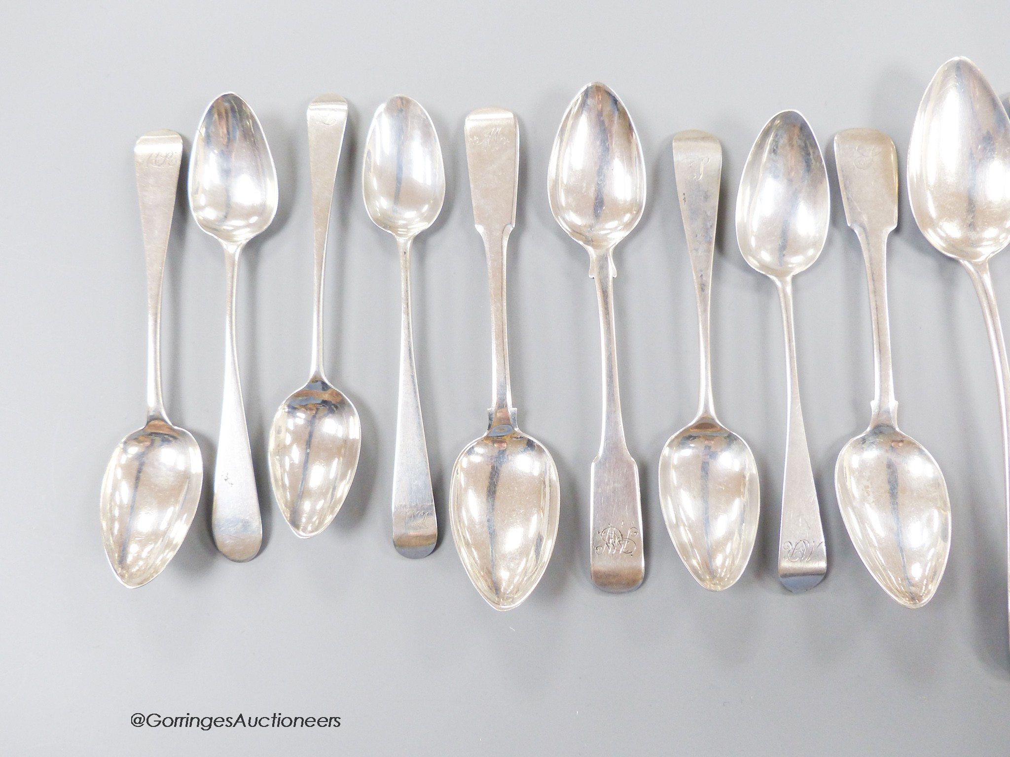 A collection of thirteen mainly 19th century Scottish provincial Banff silver spoons, including two fiddle pattern table spoons, John Keith & William Simpson, 22.5cm, two dessert spoons, John Keith and George Elder and n